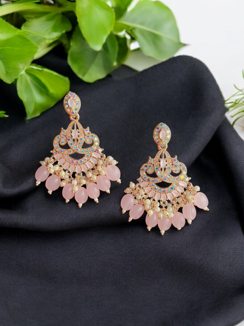 Introducing statement traditional earrings. Featuring rainbow color stones and peach color stones. Adorned with the pearls and peach color beads hanging down. Material - Alloy Style - Drop Earrings Weight - 22 gm Size -   7 cm Color - baby pink Closure Type - Push Back Code - JP9235064 Price - 350