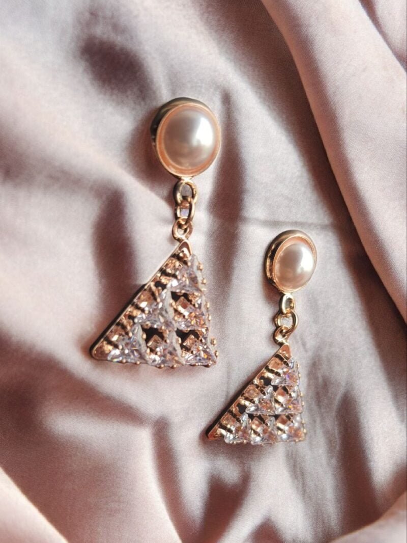 Discover elegance redefined with our exquisite Western earrings crafted from brass metal. Embrace the allure of triangle-shaped dangle and drop earrings,