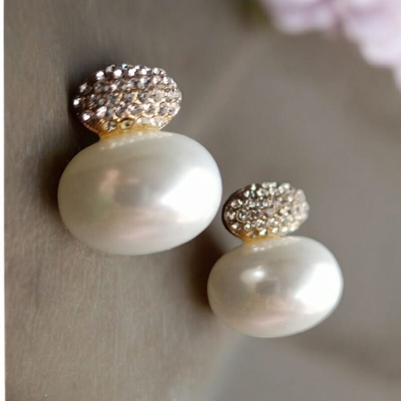 Introducing stud design with large, lustrous pearls as the centerpiece.